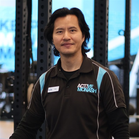 Personal Trainer standing in gym floor